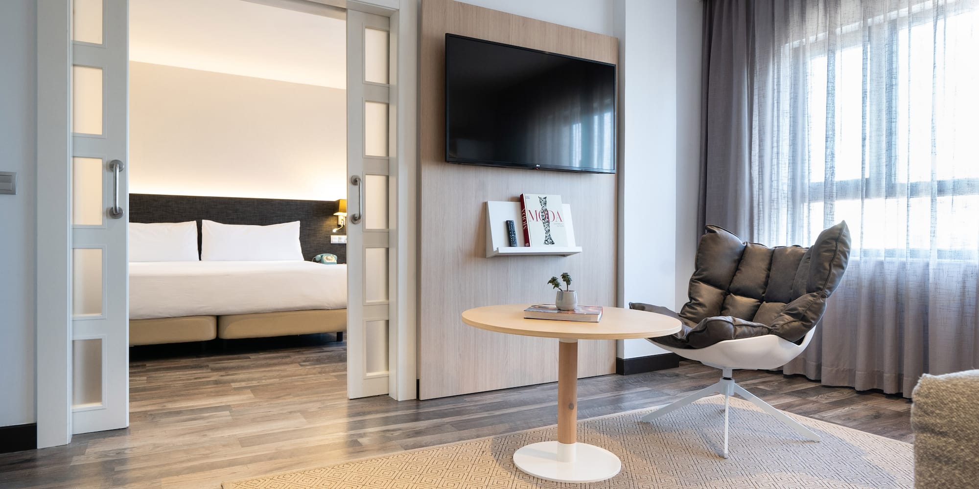 a room with a tv and a chair