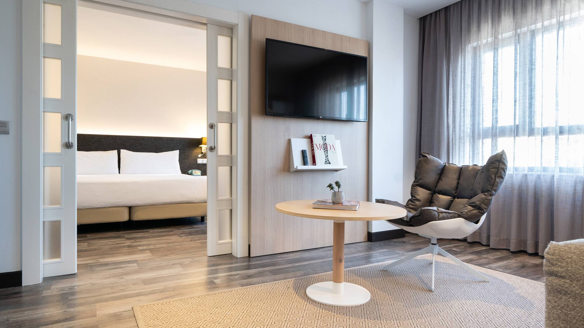 a room with a tv and a chair