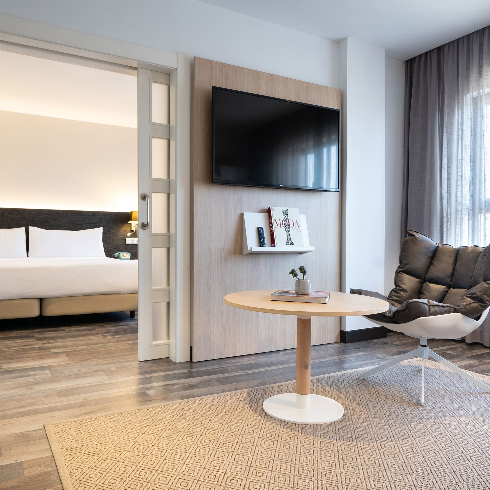 a room with a tv and a chair