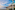 Sunset over Tazacorte, La Palma coastal town with ocean, lighthouse, and resort.