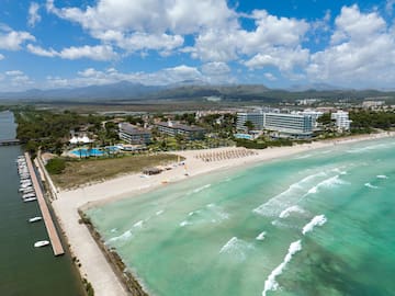 a beach with a body of water and buildings