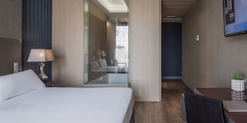 a bedroom with a glass wall