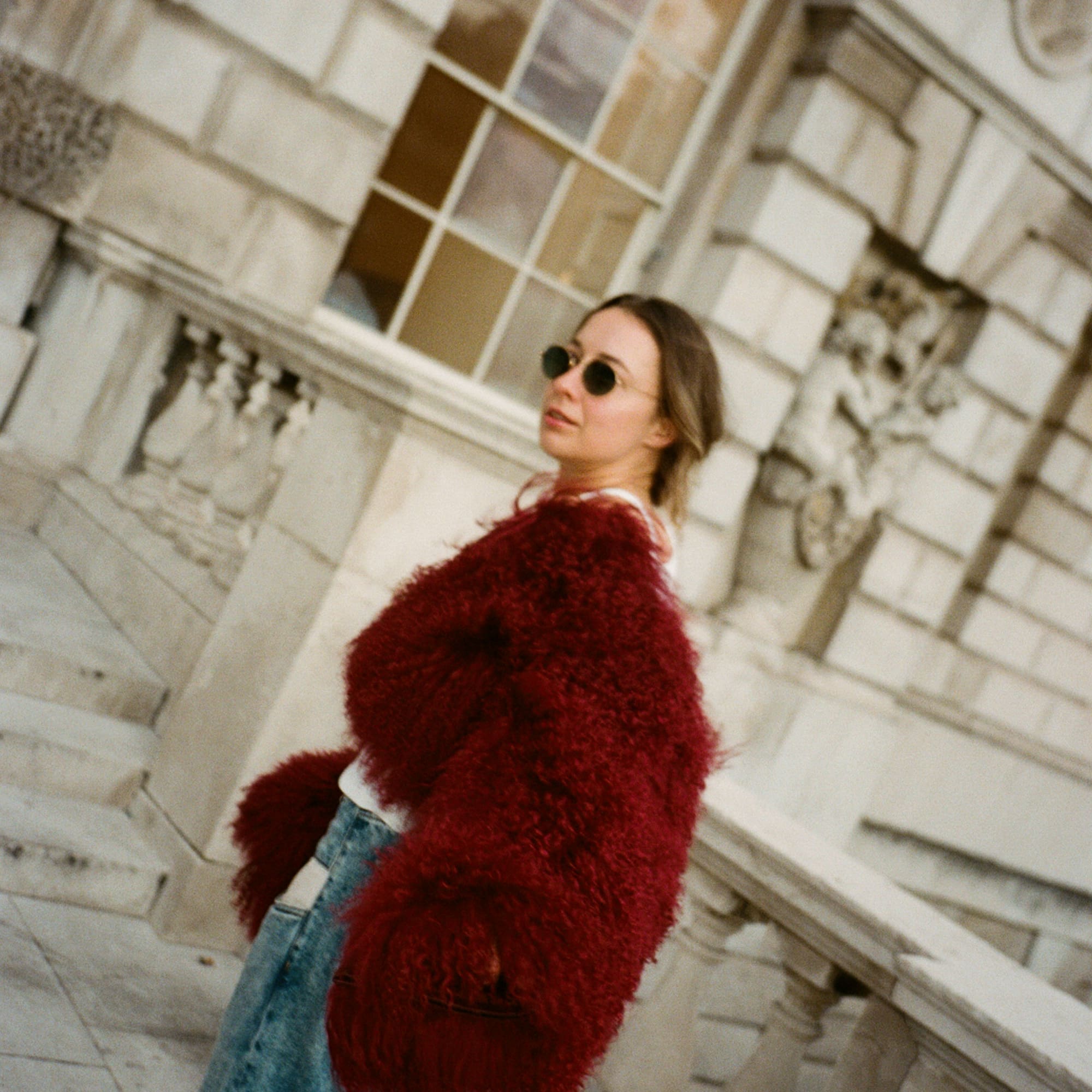 a woman standing outside a building