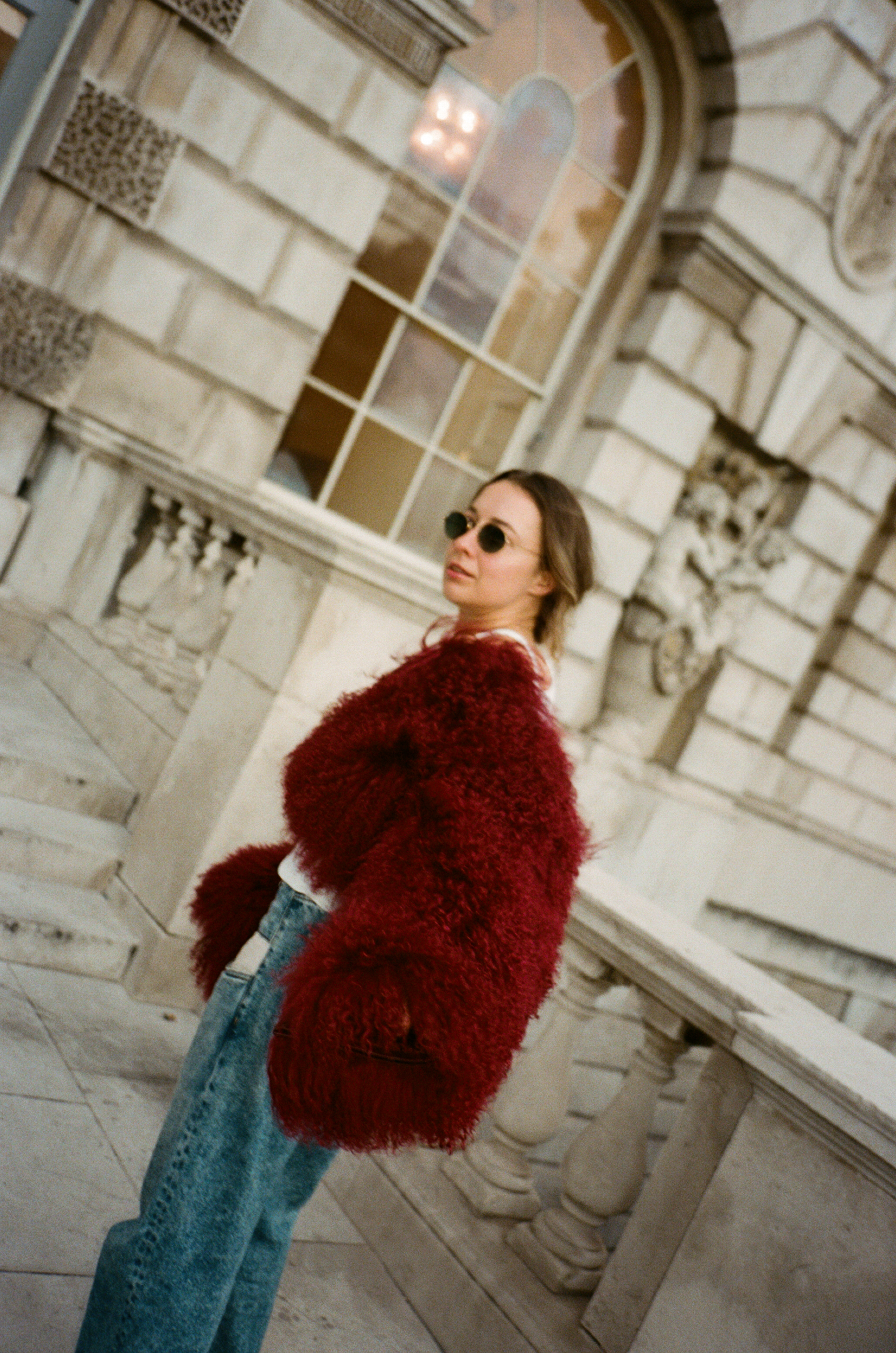 a woman standing outside a building