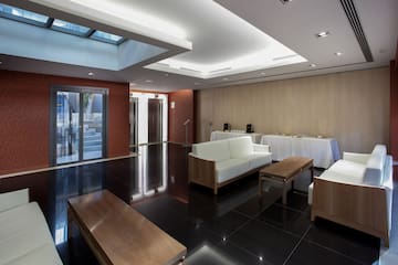 a room with white furniture and a black floor