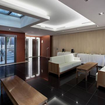 a room with white furniture and a black floor