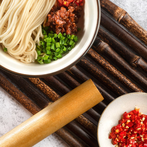a bowl of noodles and vegetables