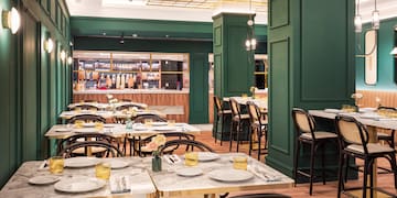 a restaurant with tables and chairs