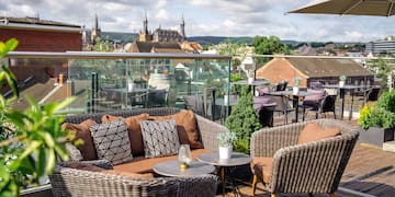 a patio with a table and chairs