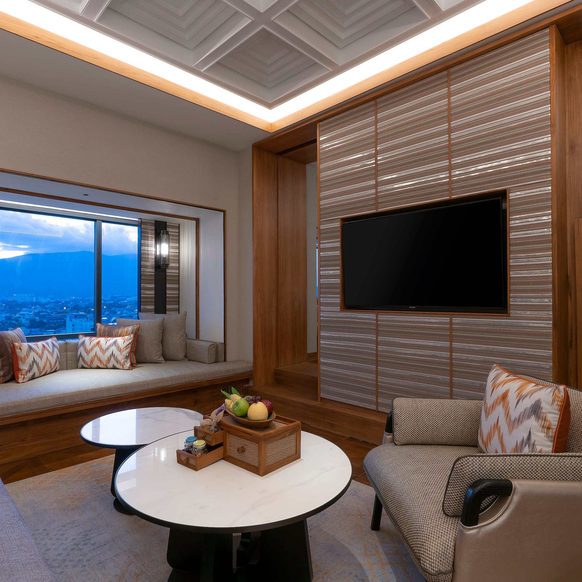 a room with a tv and a window