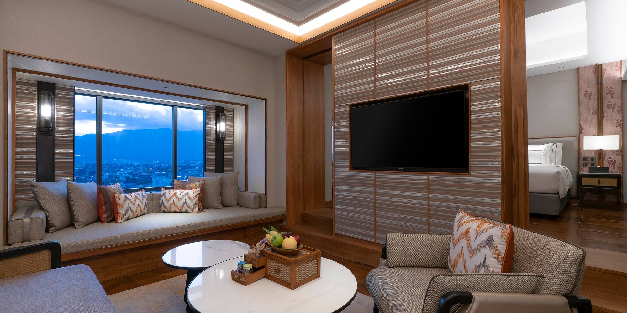 a room with a tv and a window