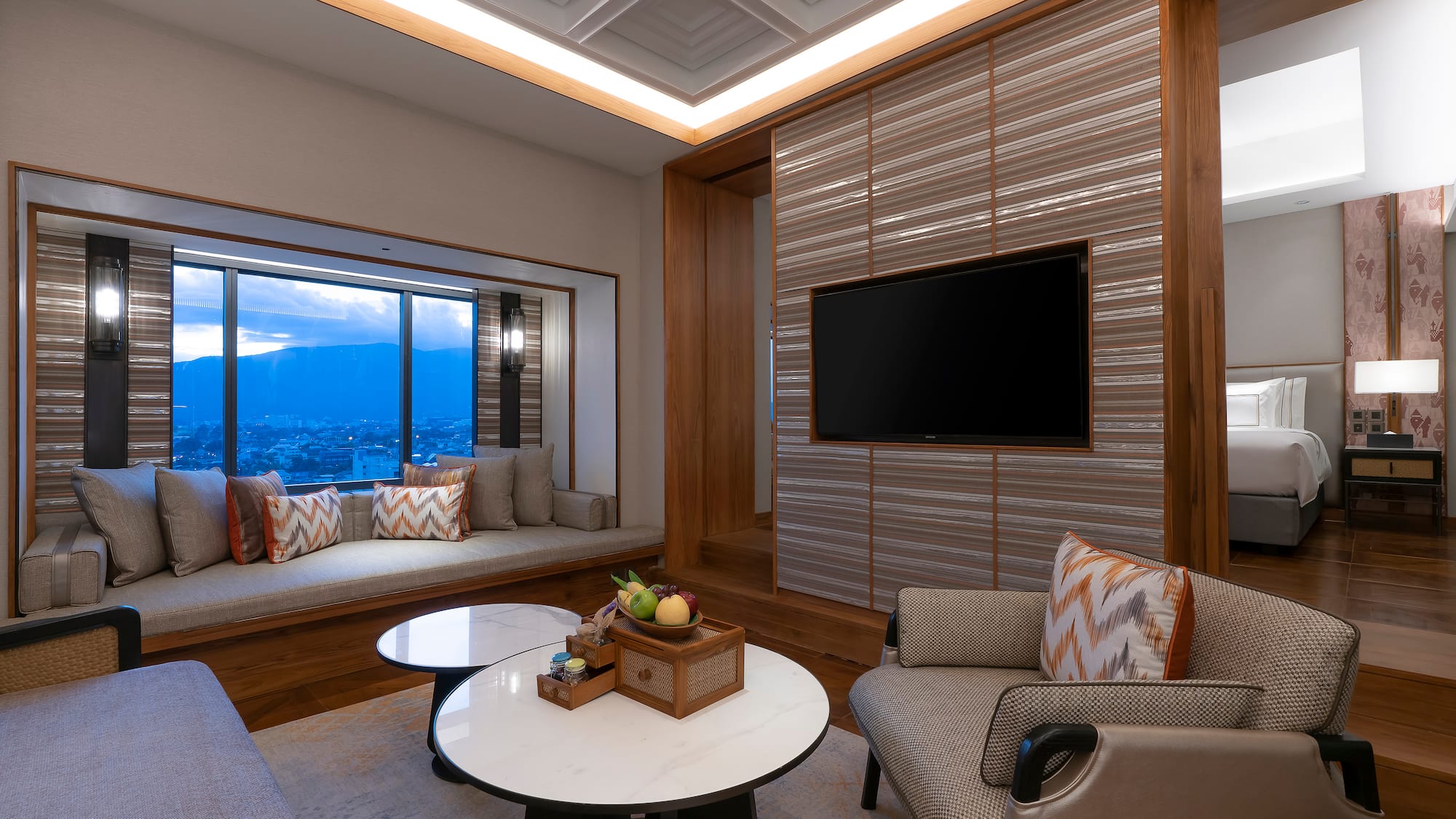 a room with a tv and a window