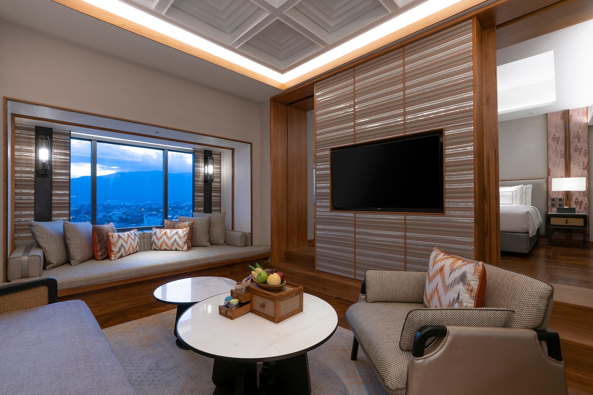 a room with a tv and a window