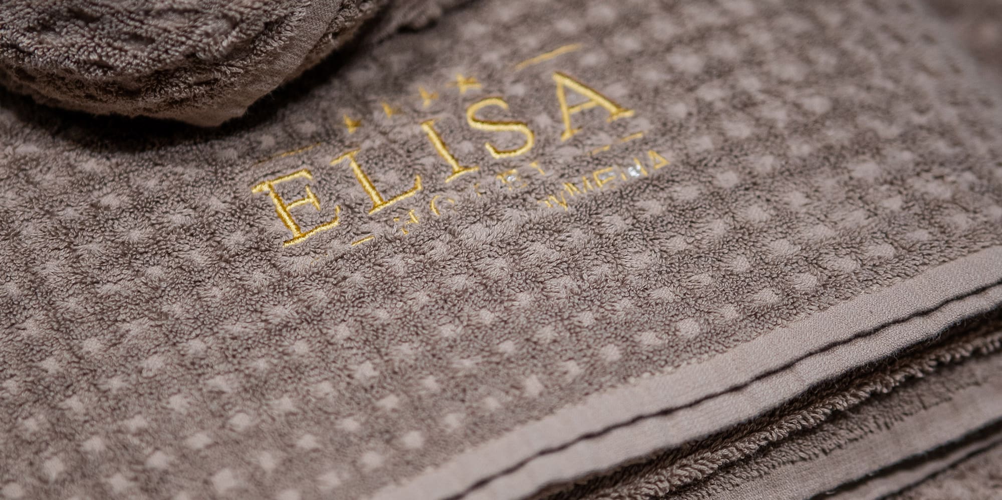 a brown towel with a name on it