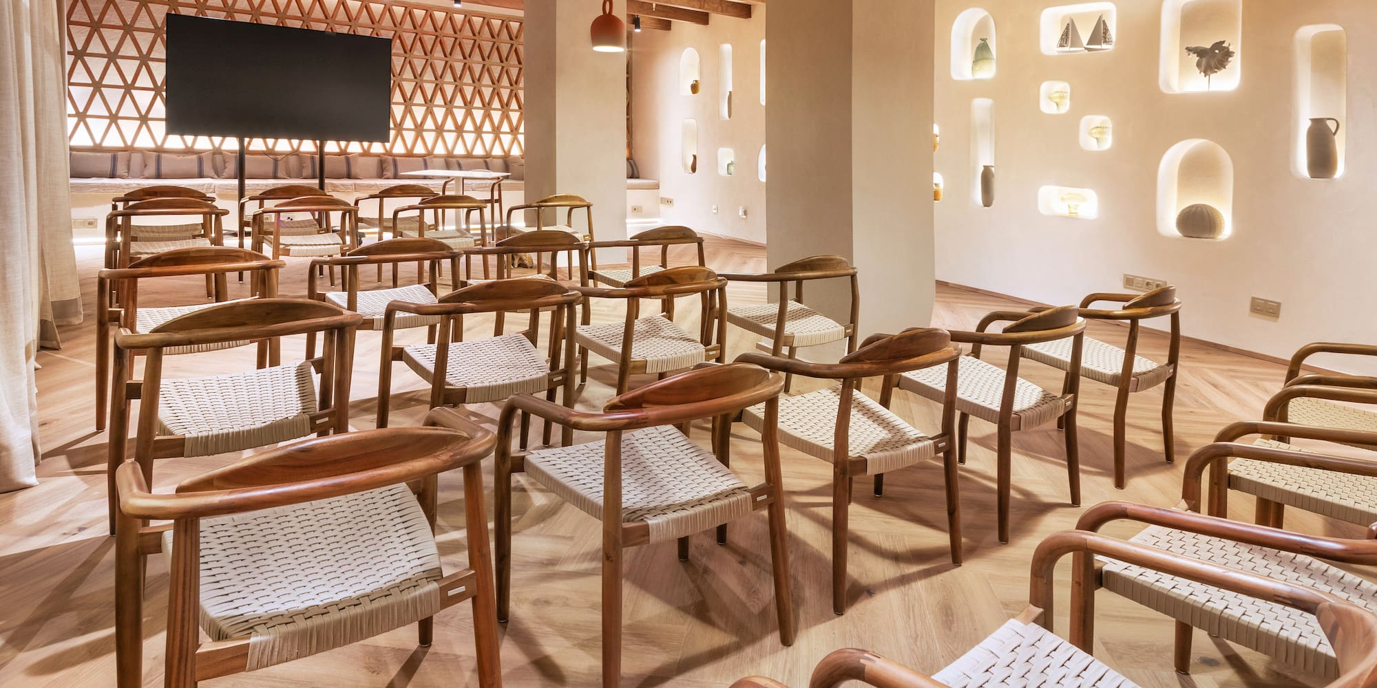 a room with chairs and a television