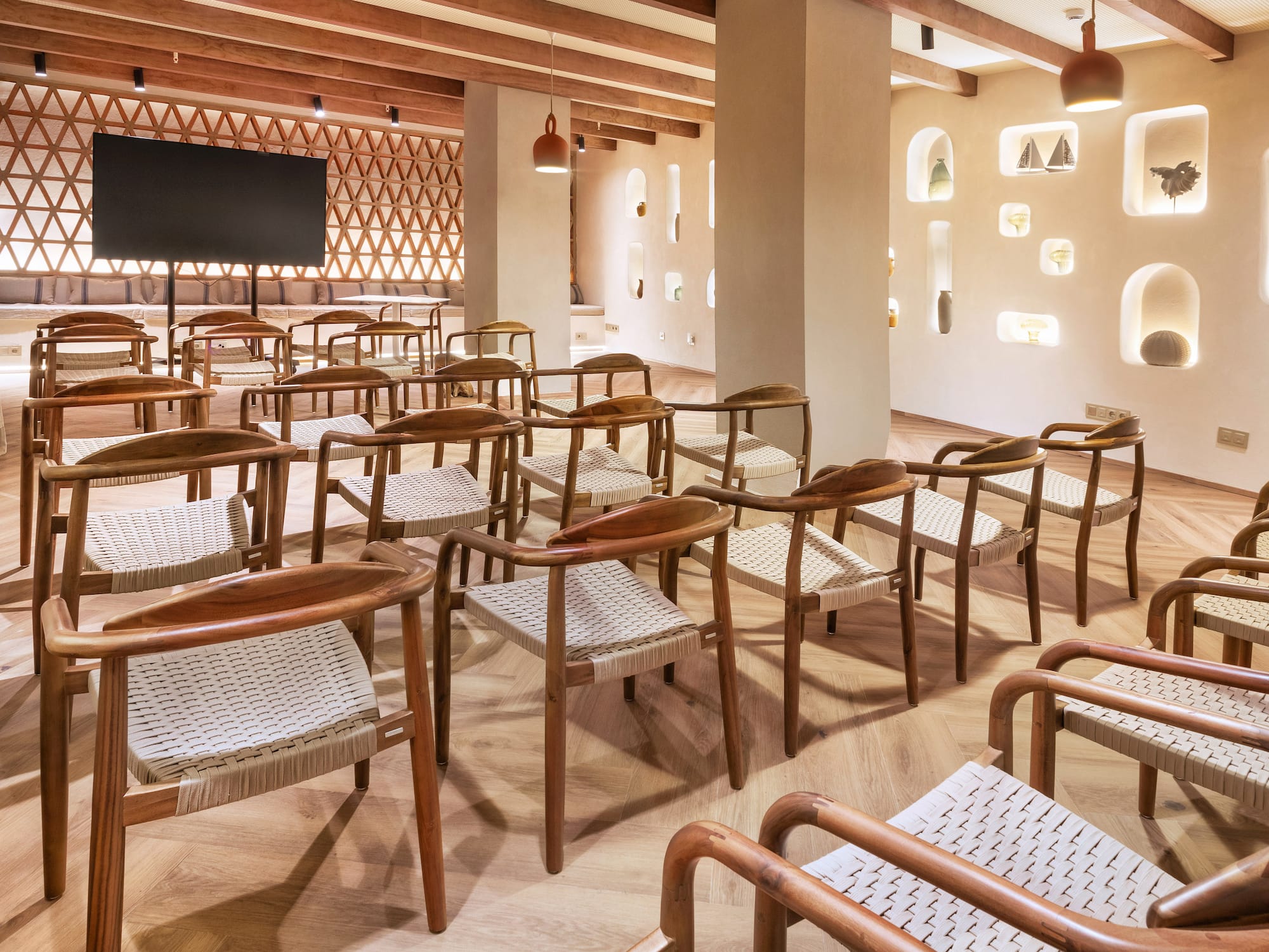 a room with chairs and a television