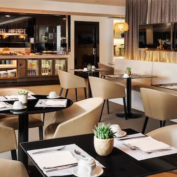 a restaurant with tables and chairs