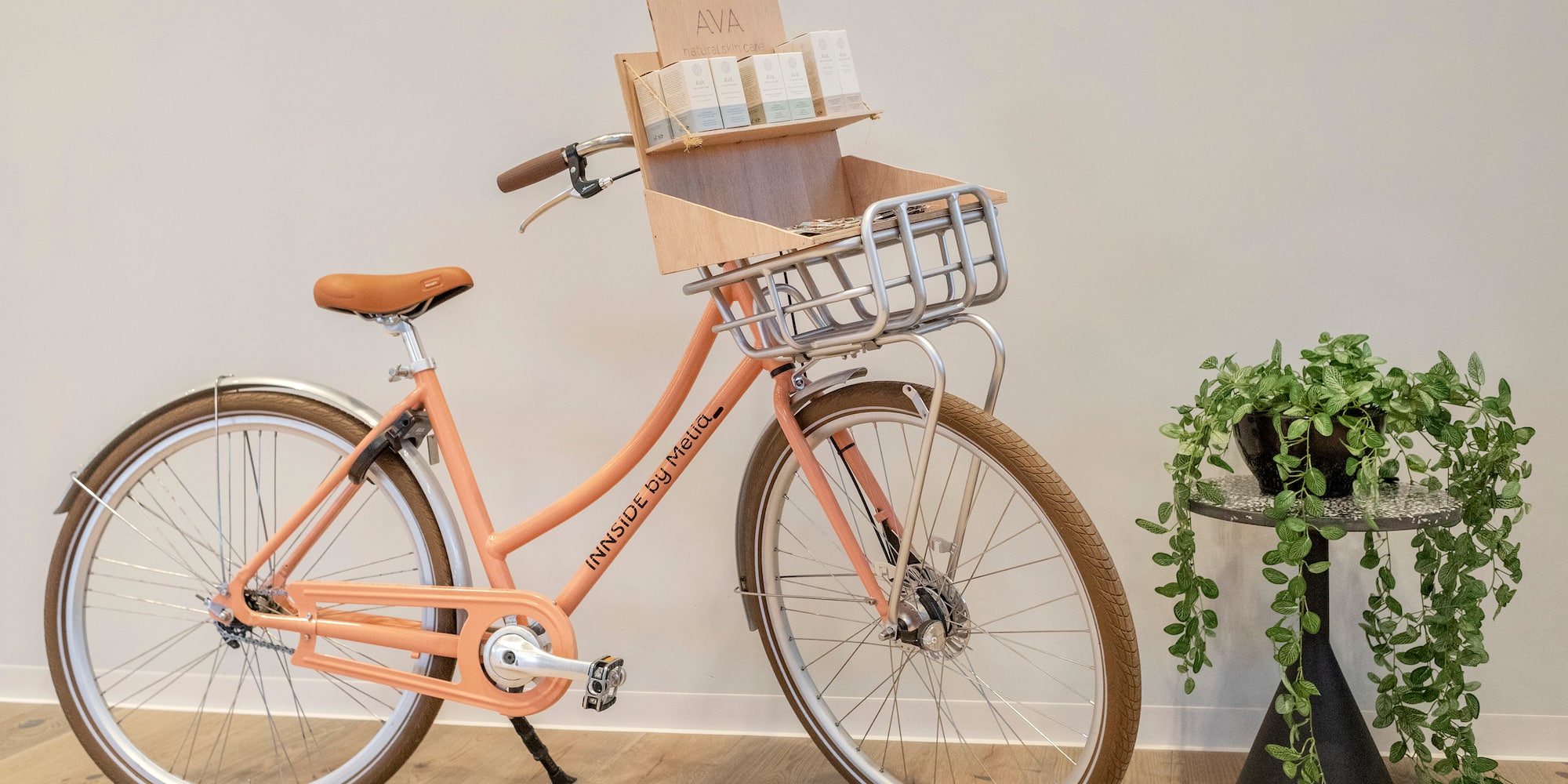 Innside by Melia coral bike, basket with AVA natural skin care products.