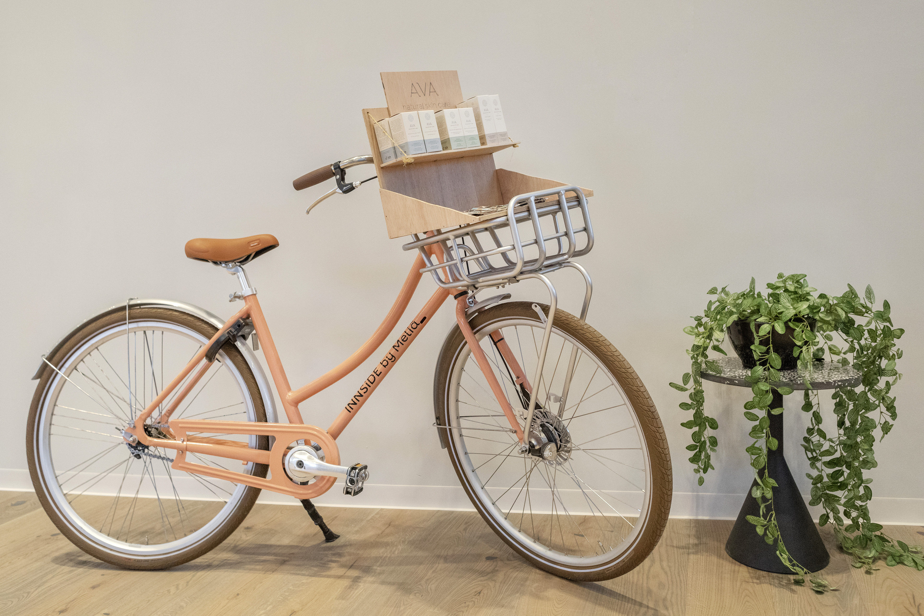 Innside by Melia coral bike, basket with AVA natural skin care products.