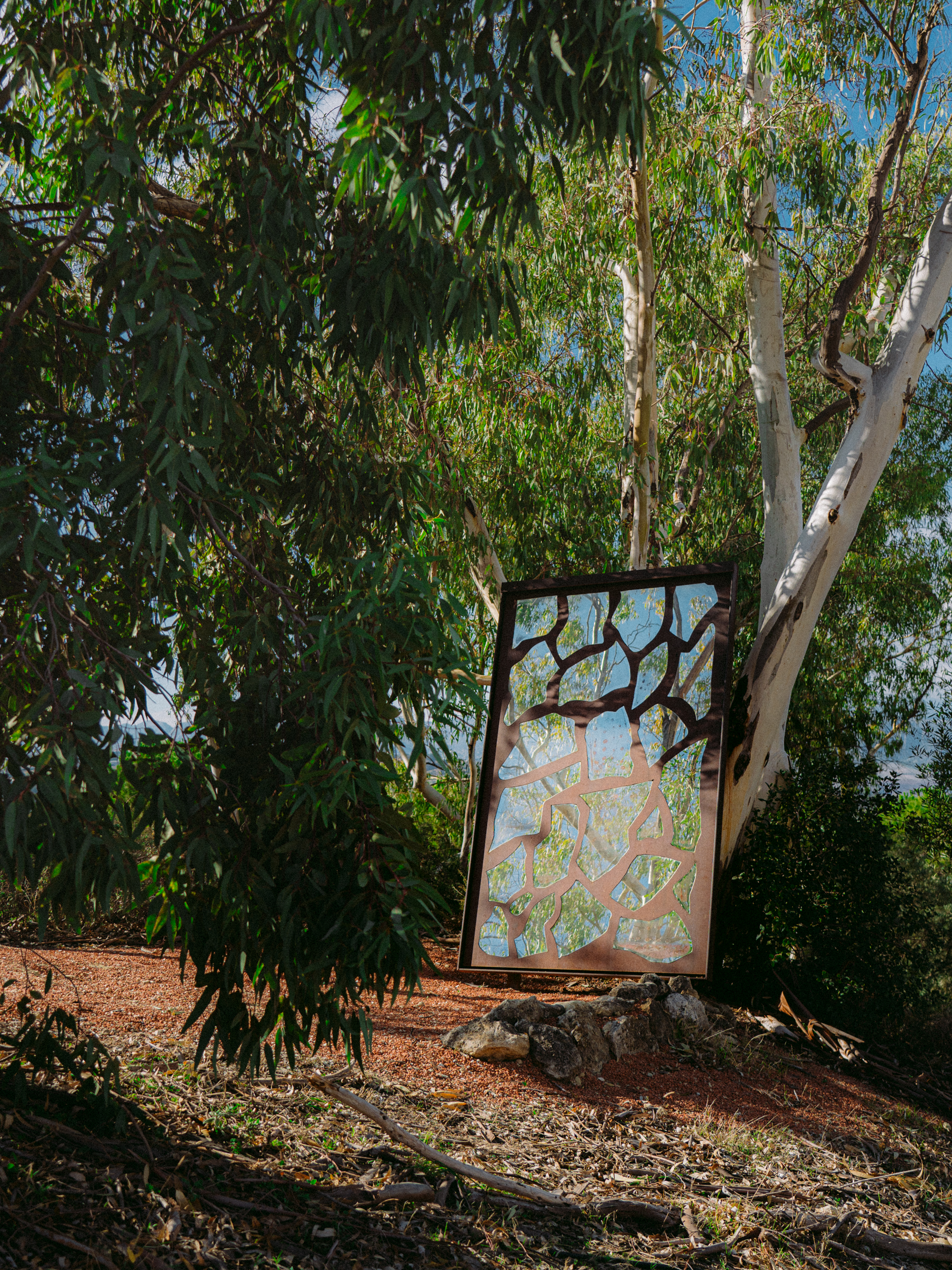 a metal sculpture in a tree