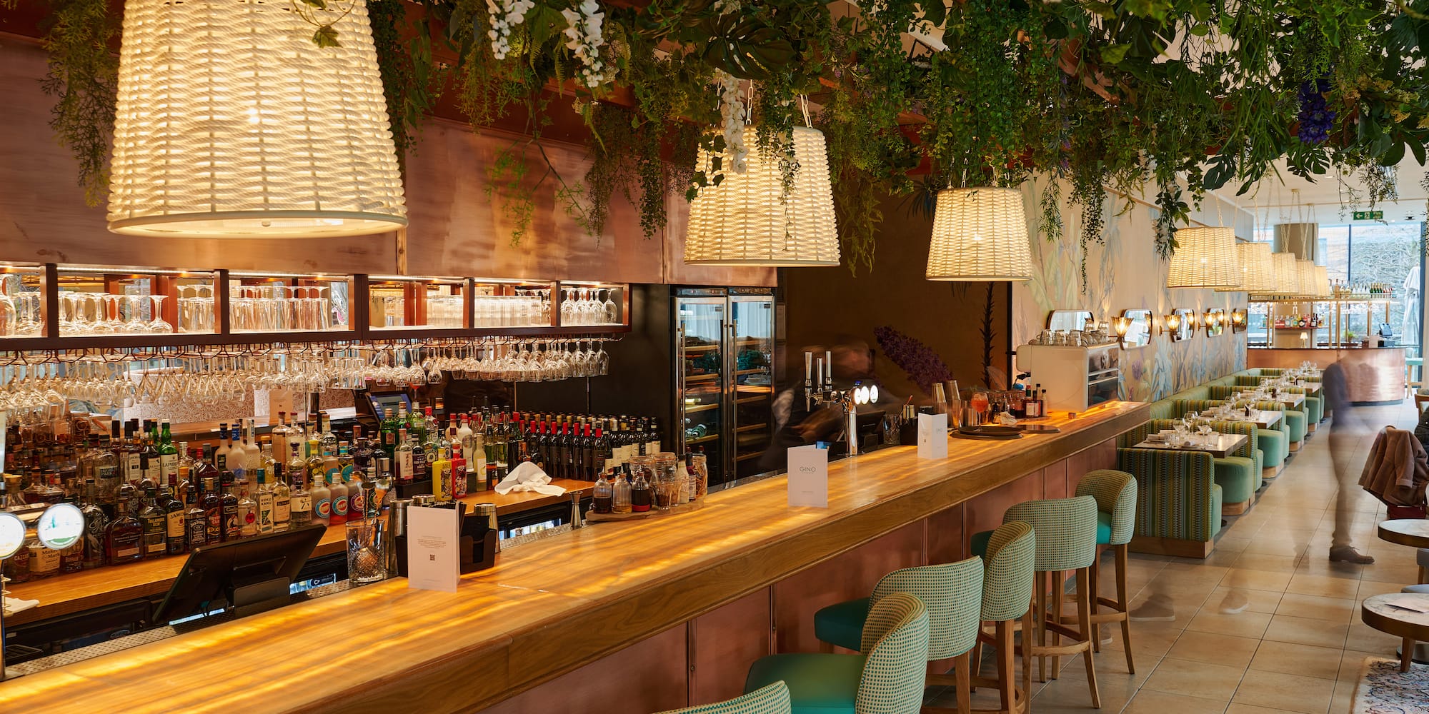 a bar with chairs and lights