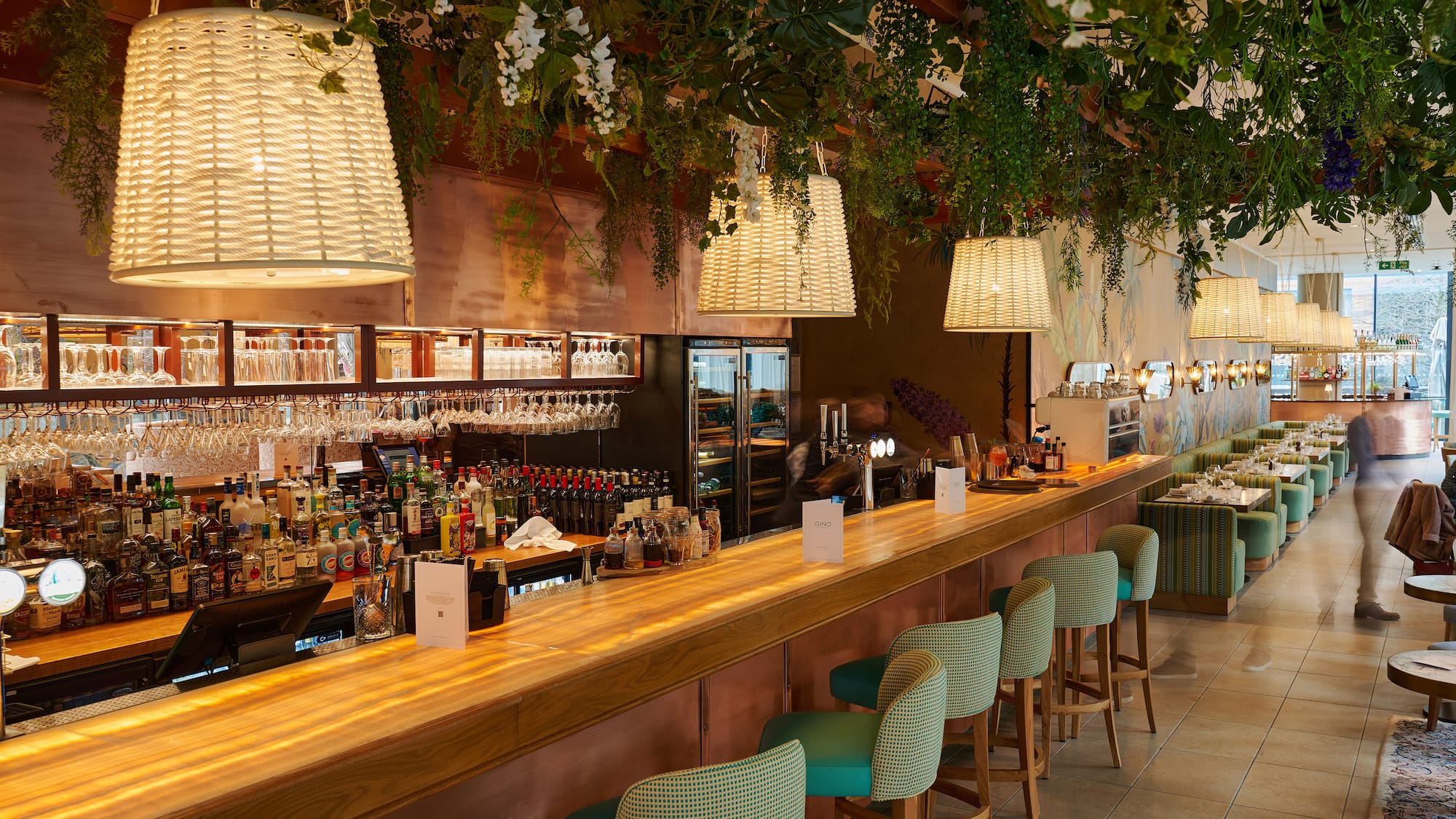 a bar with chairs and lights