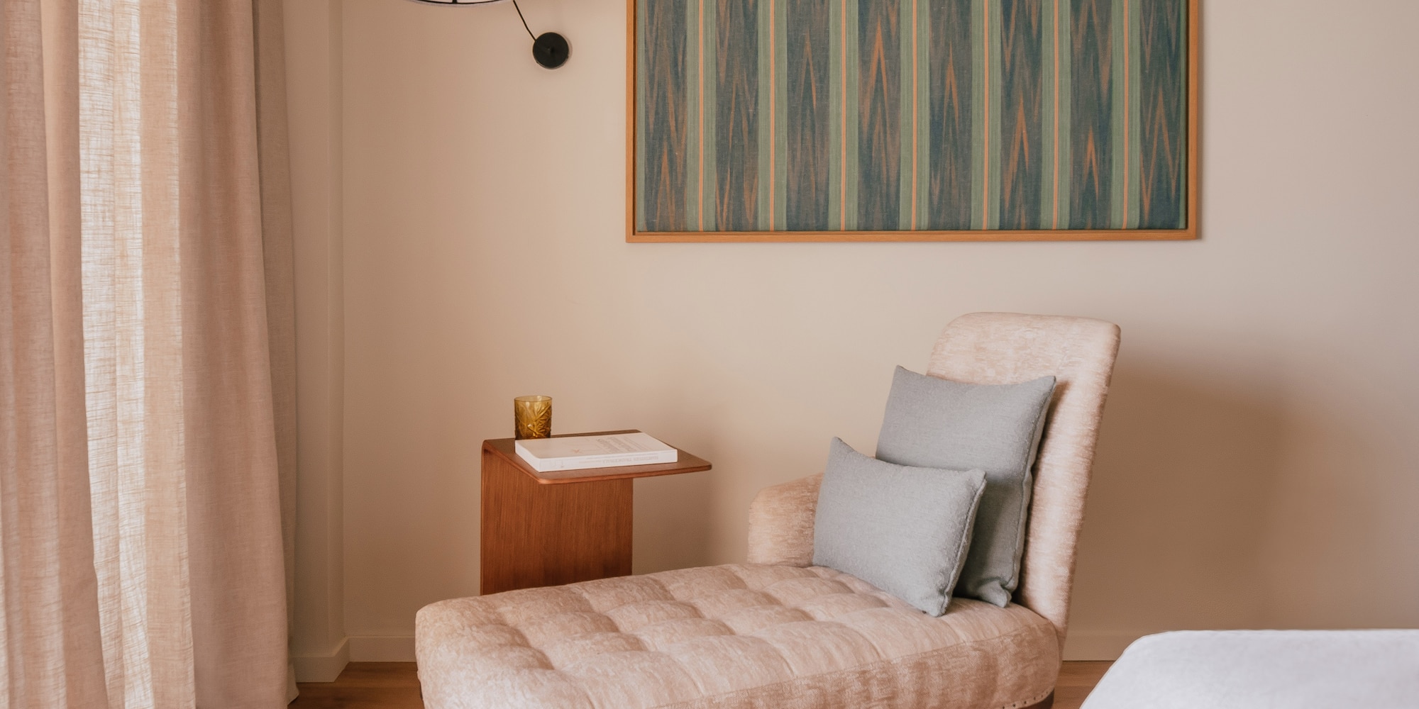 a chaise lounge in a room