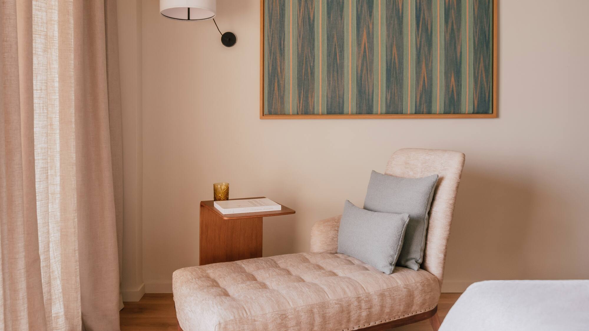 a chaise lounge in a room