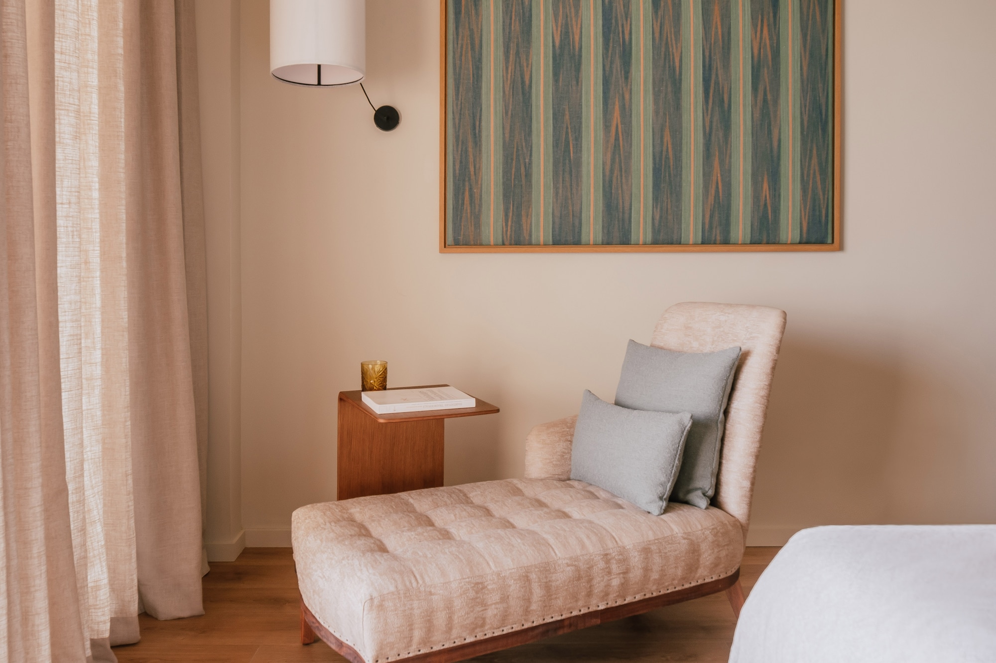 a chaise lounge in a room