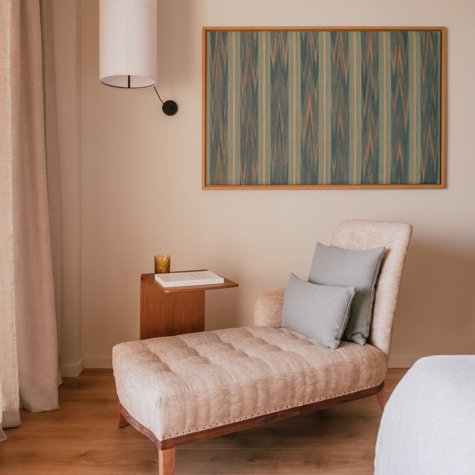 a chaise lounge in a room