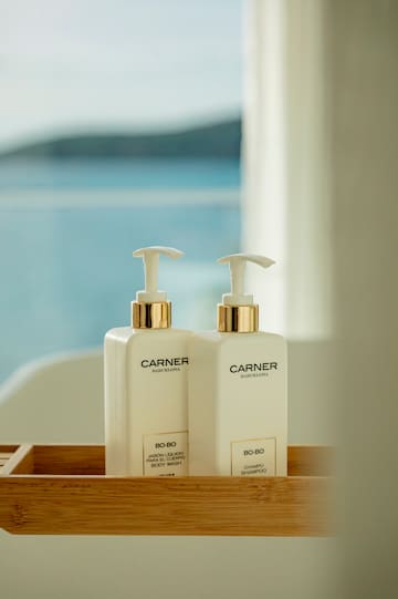 a couple of white bottles with black lettering on them