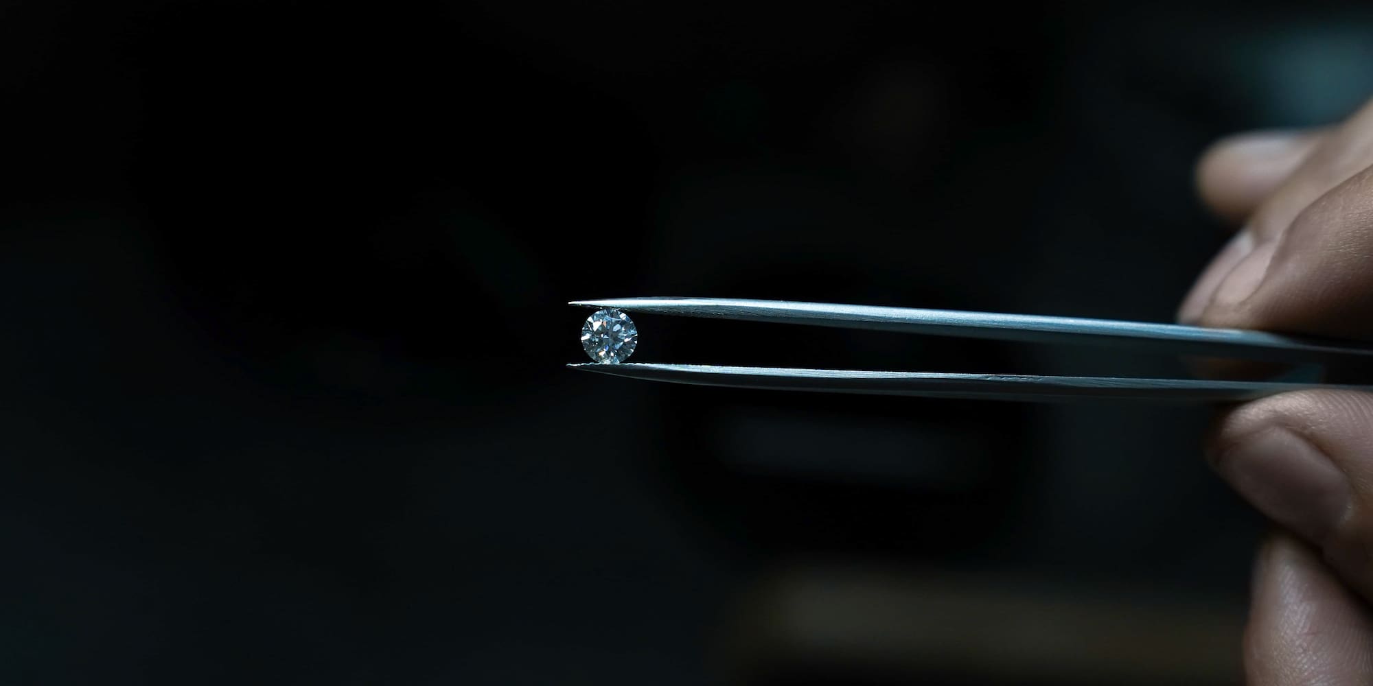 a diamond on a tweezers