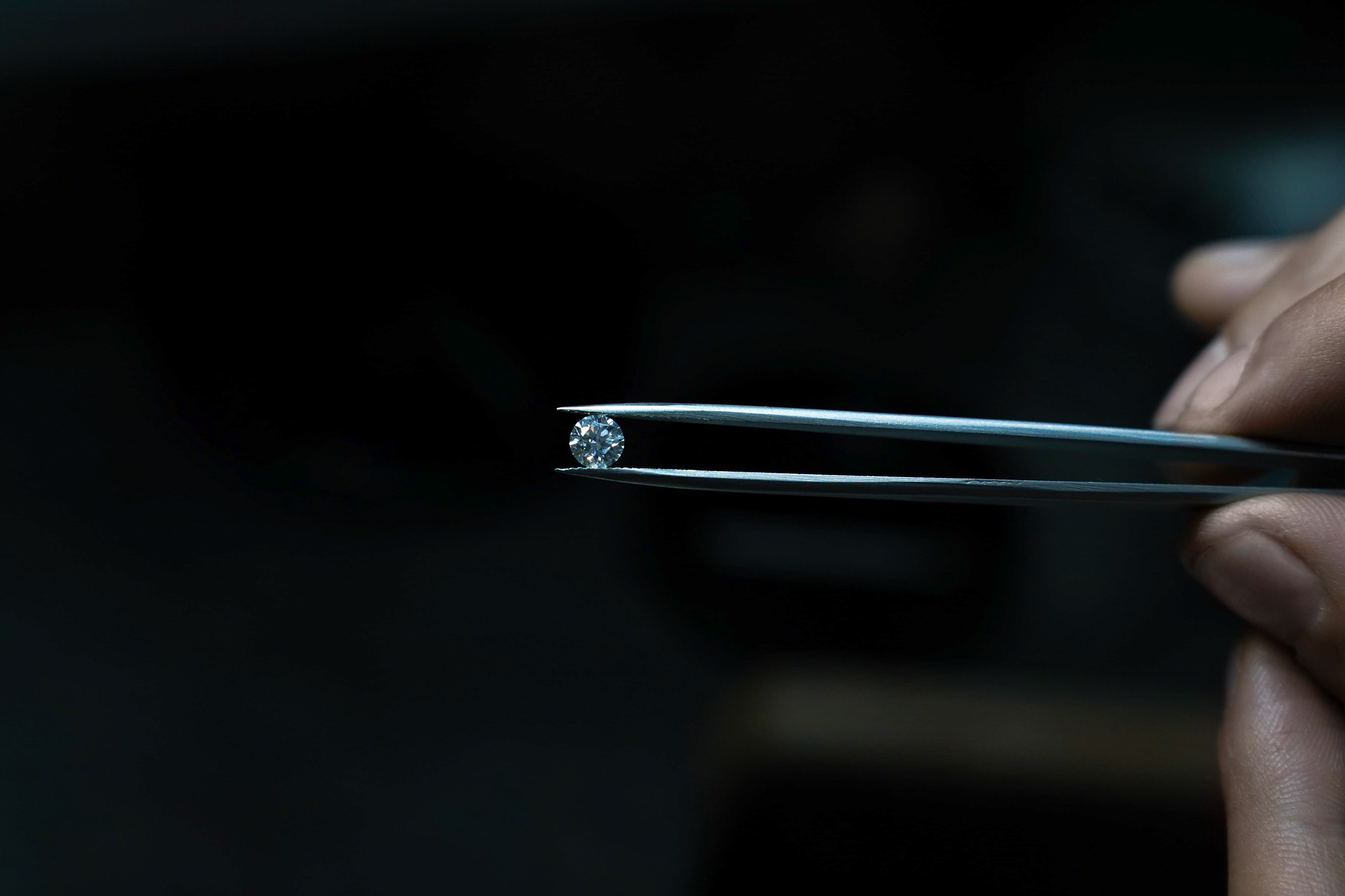 a diamond on a tweezers
