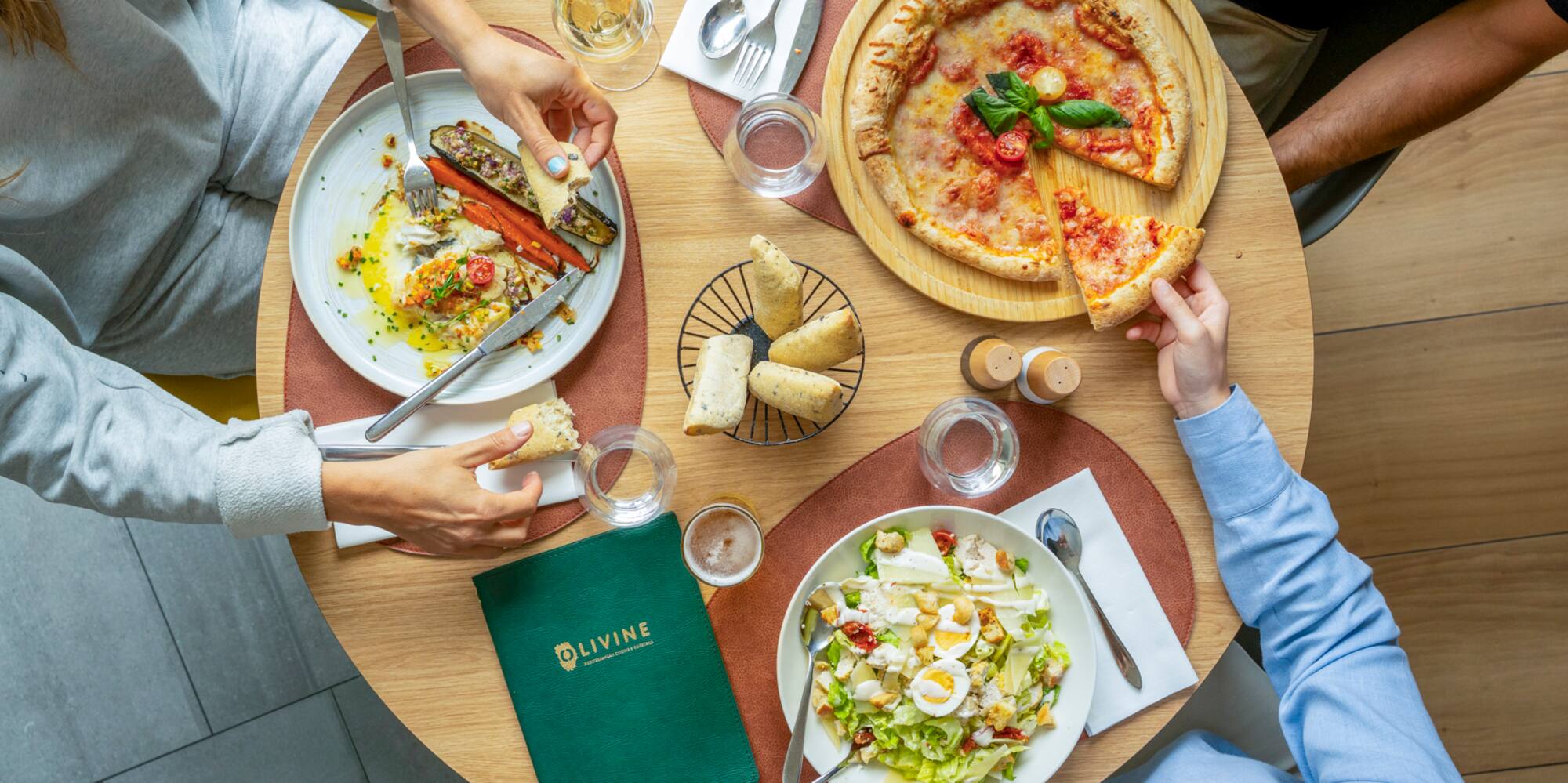 a group of people eating at a table