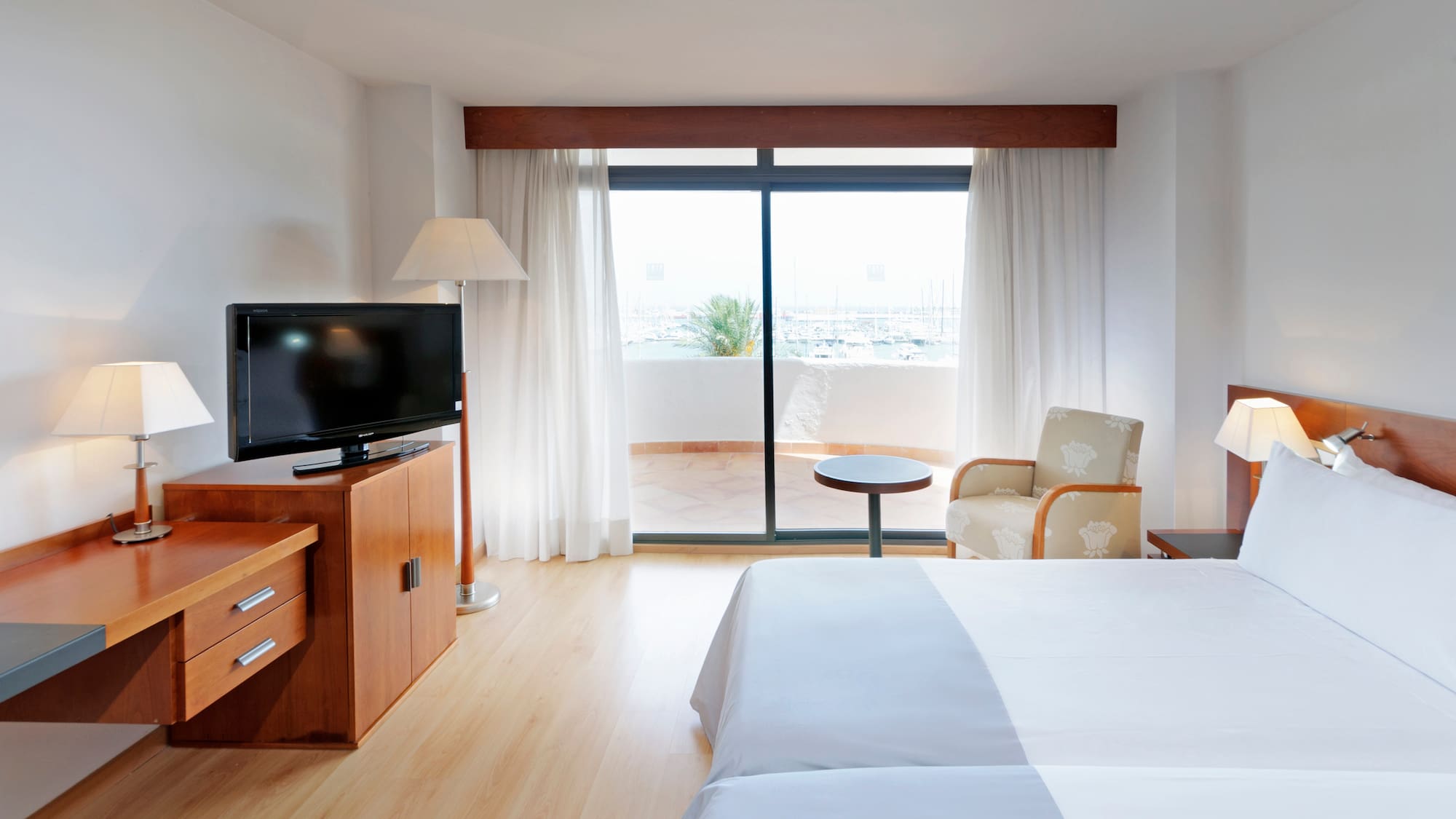 a room with a television and a bed