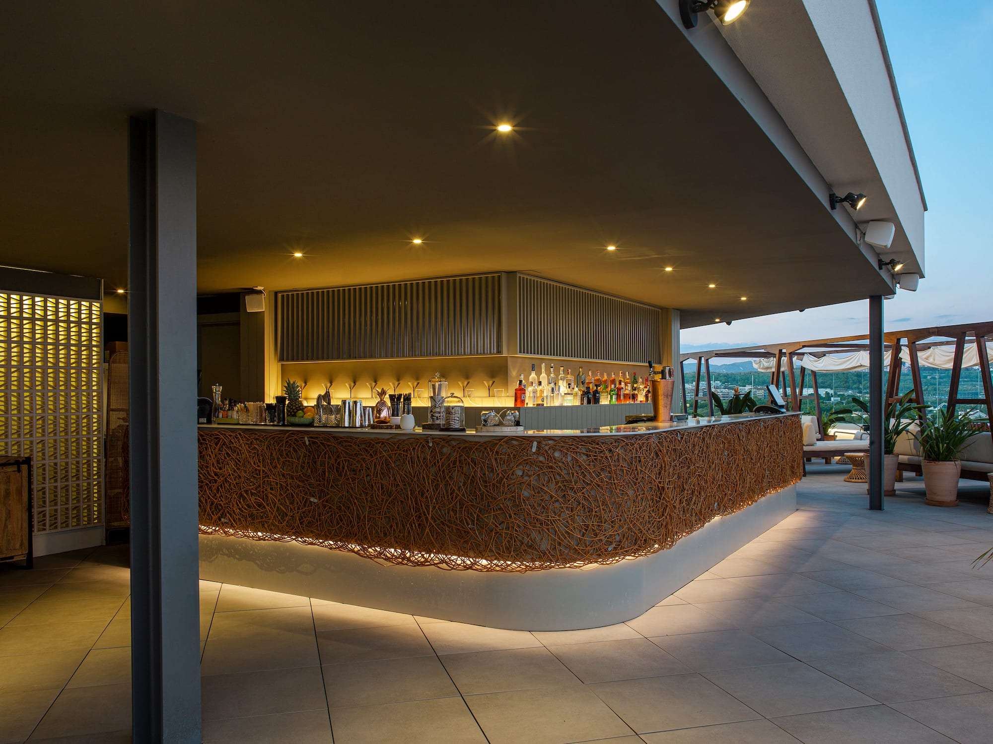 a bar with lights on the counter