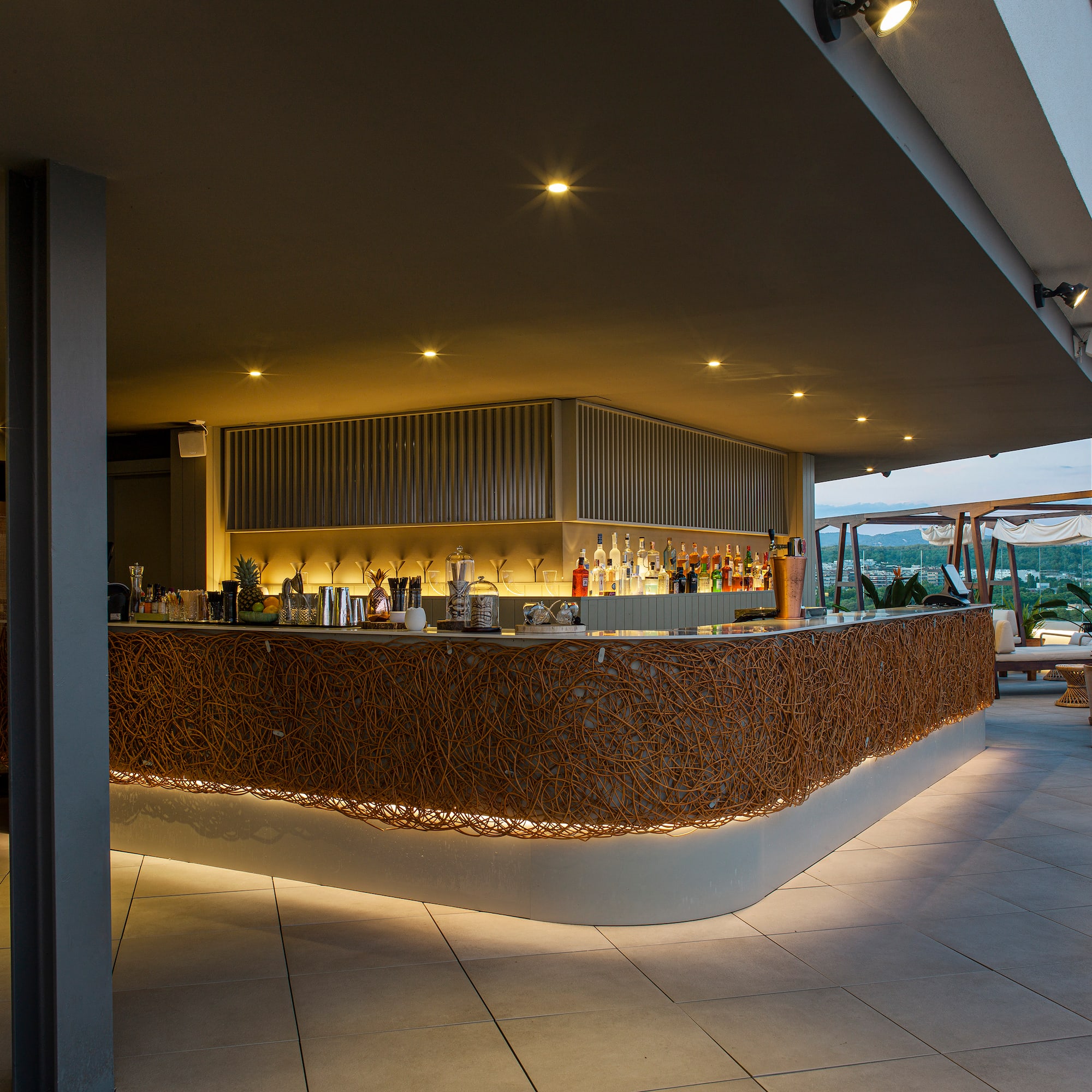 a bar with lights on the counter