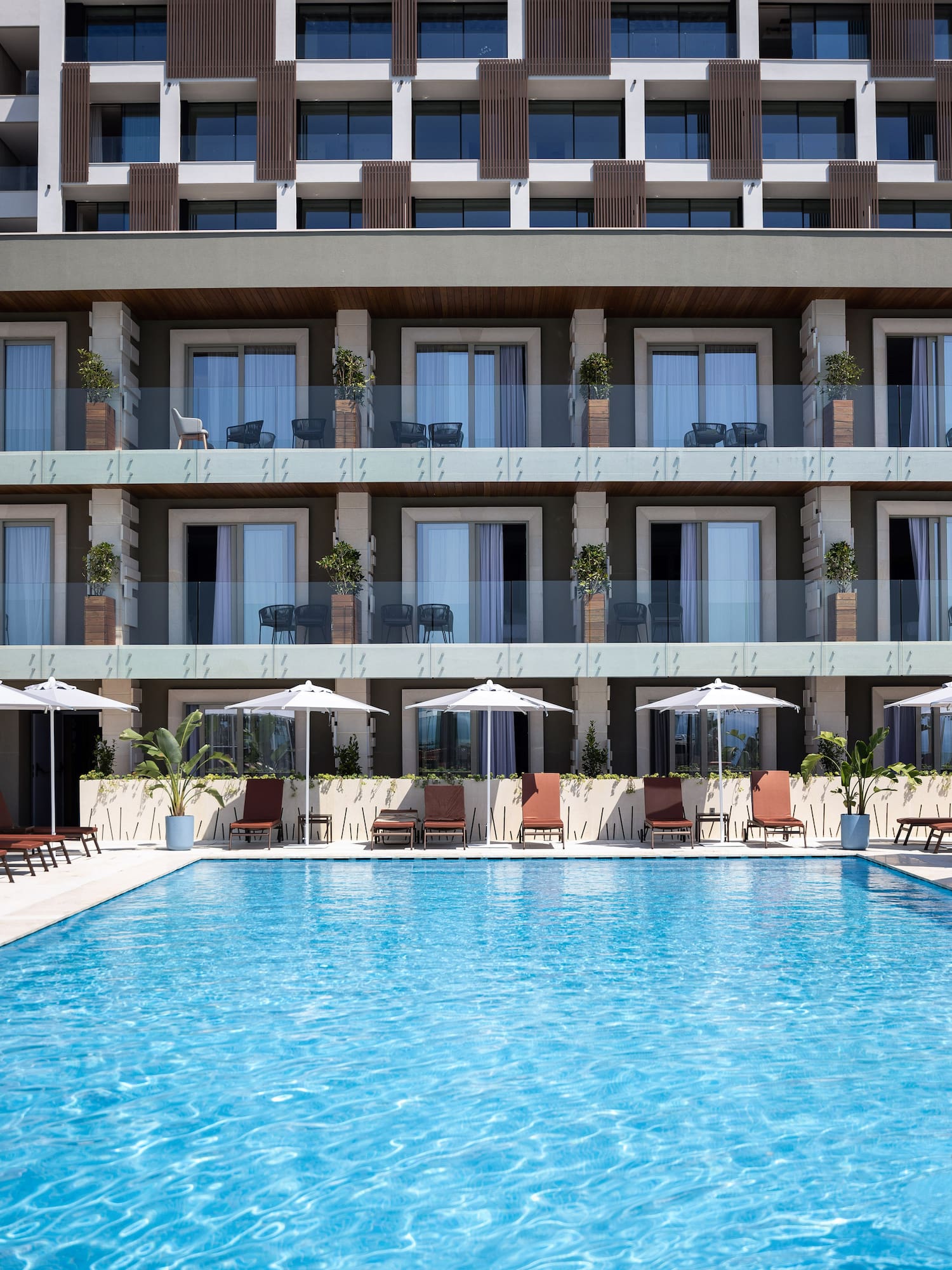 a swimming pool in front of a building