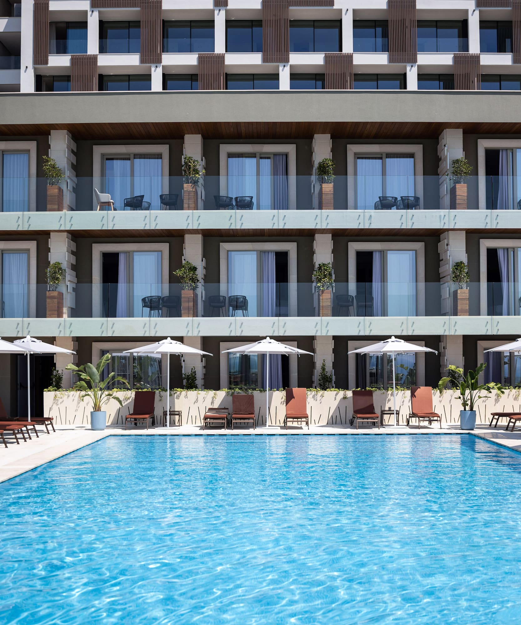 a swimming pool in front of a building