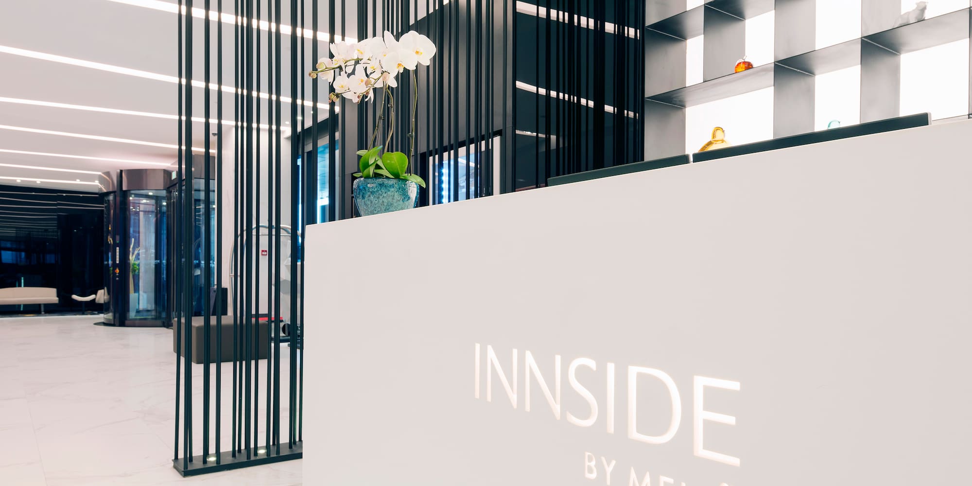 a white reception desk with black lines
