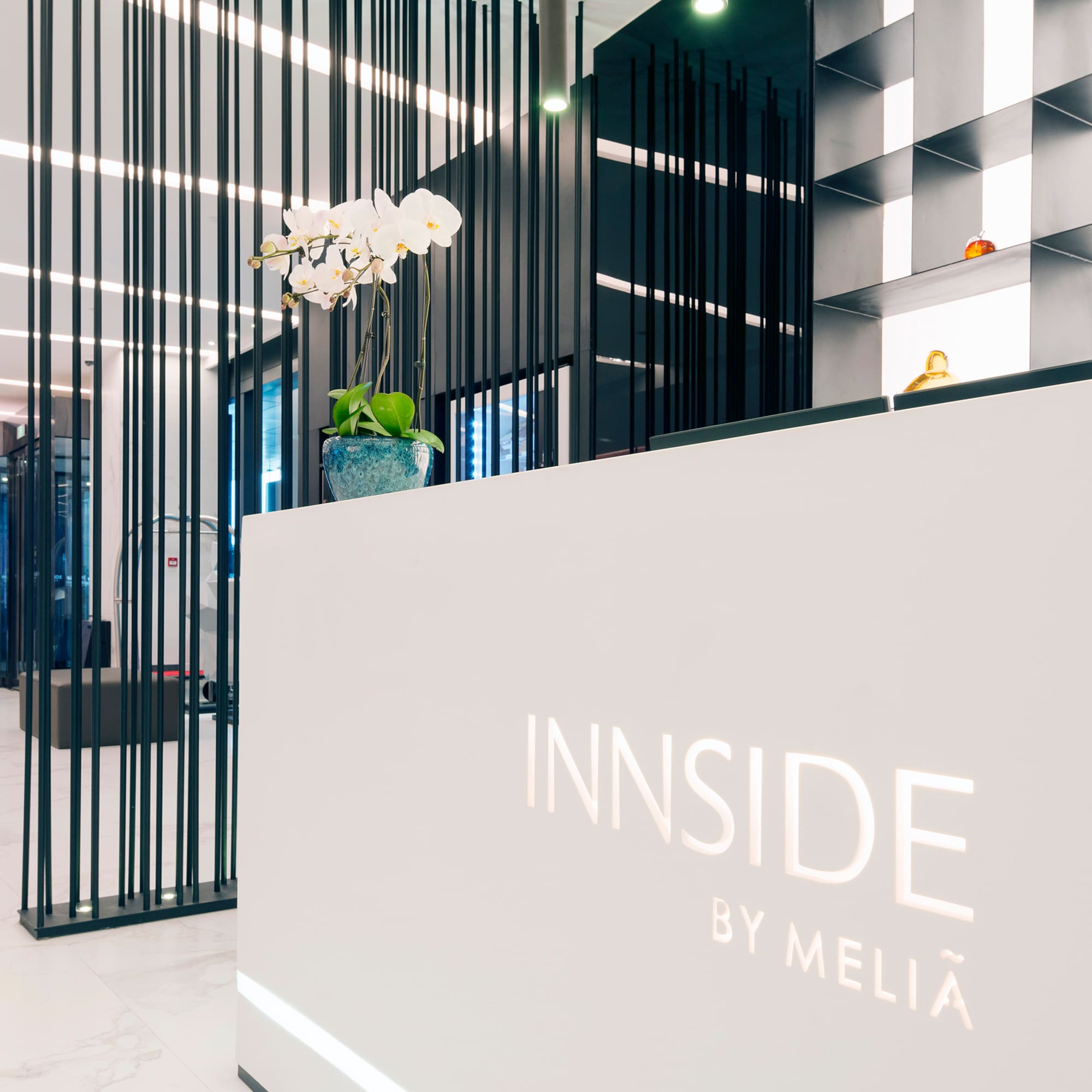 a white reception desk with black lines