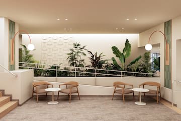 a room with chairs and tables