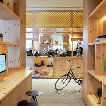 a room with a bicycle and shelves