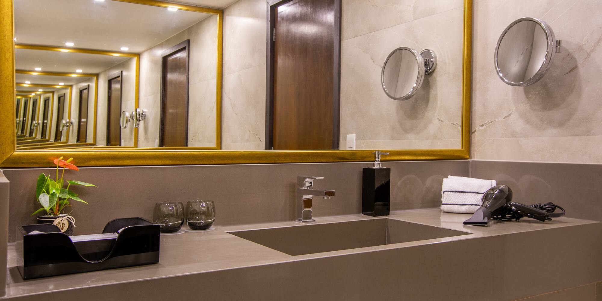 a bathroom with a mirror and sink