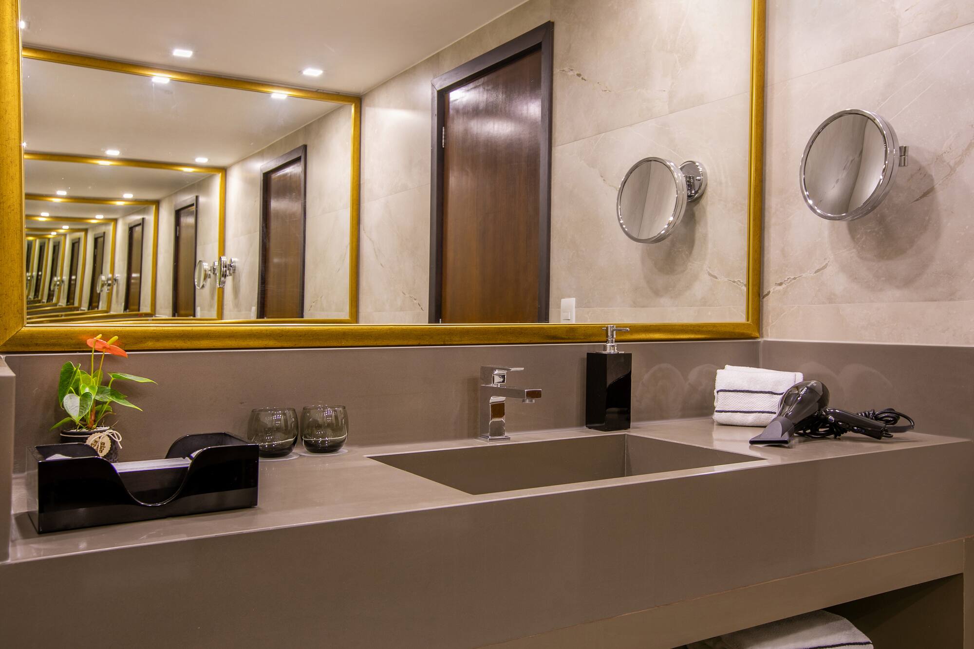 a bathroom with a mirror and sink