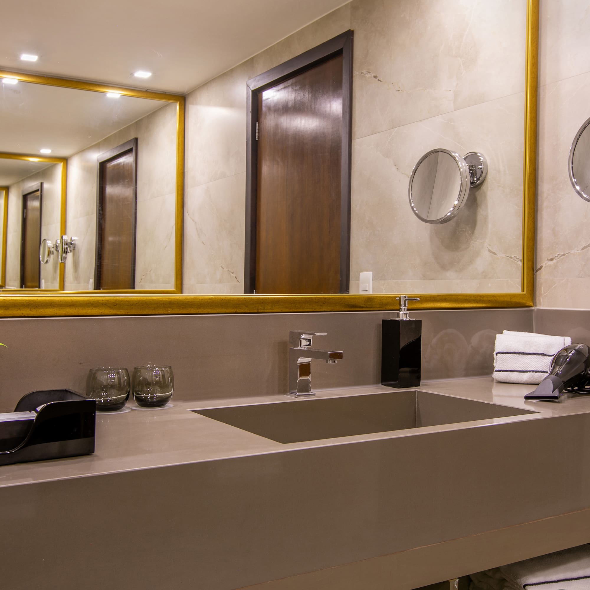 a bathroom with a mirror and sink