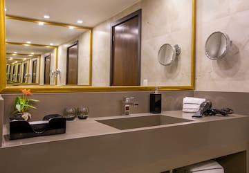 a bathroom with a mirror and sink