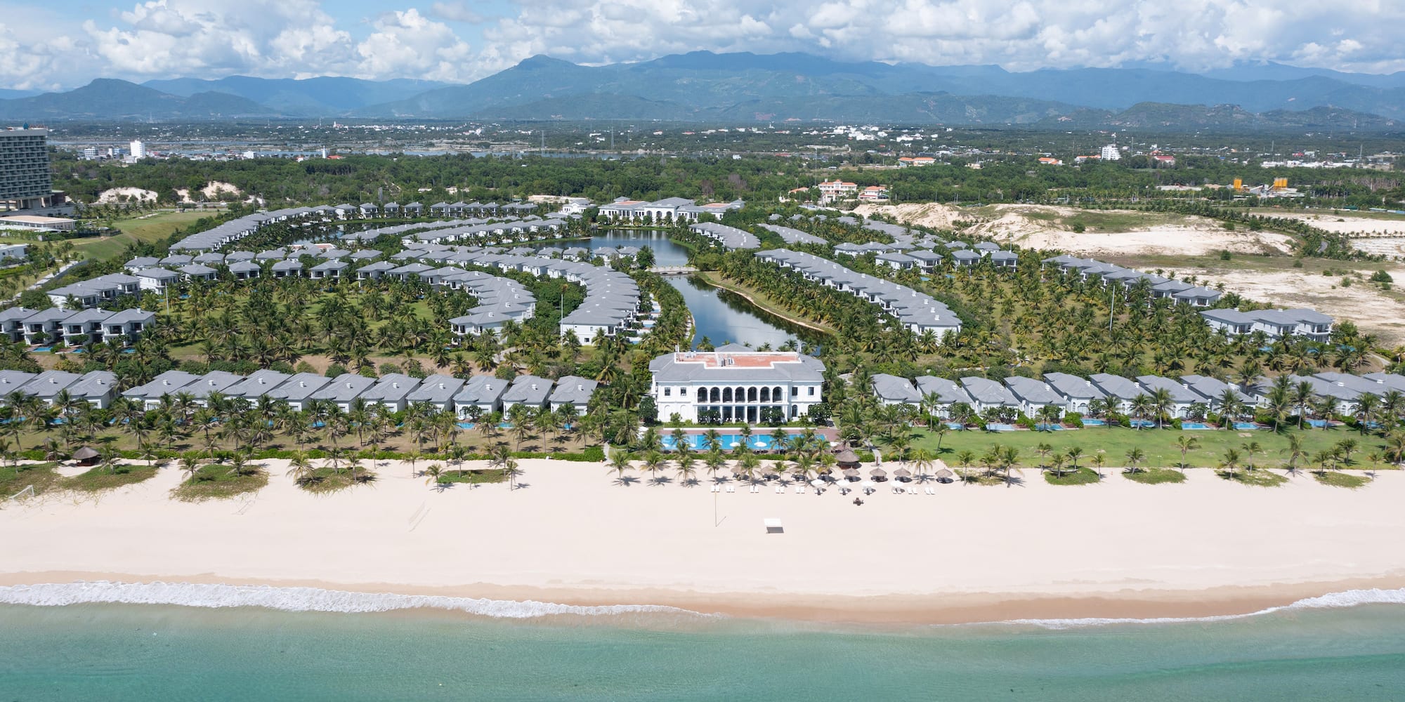 a large group of buildings on a beach