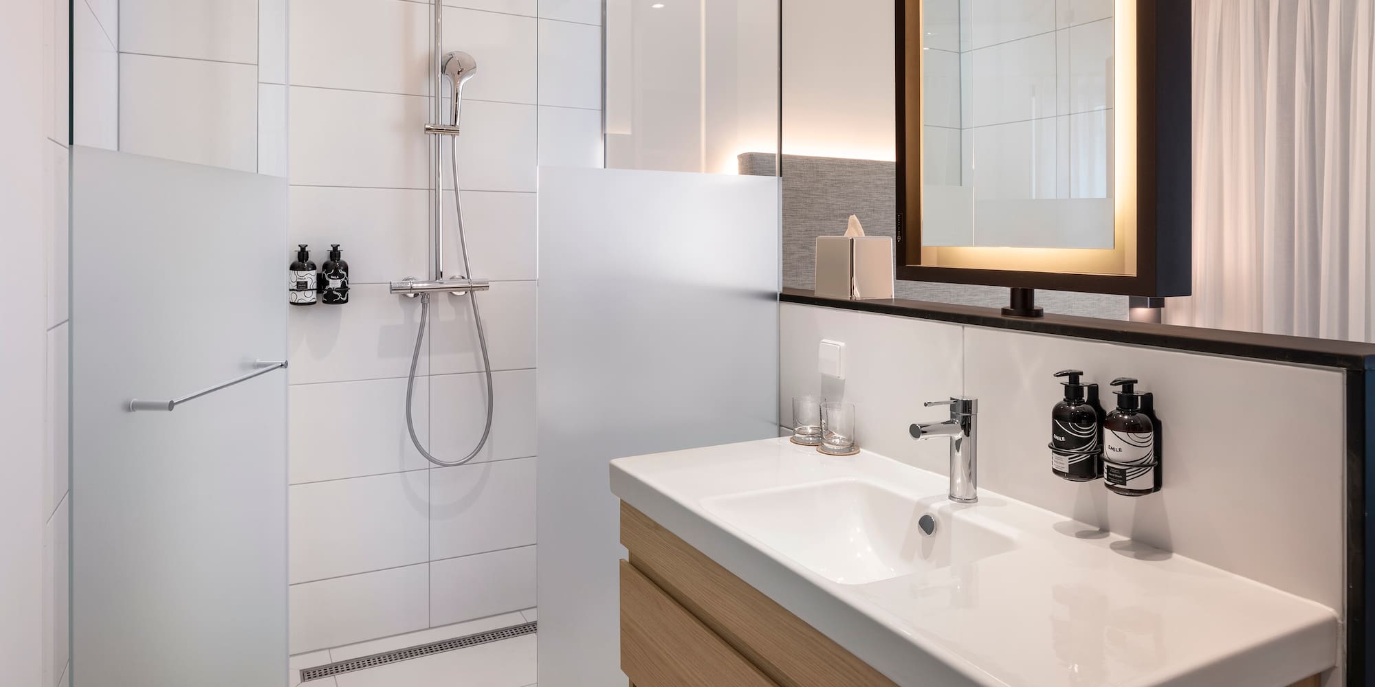 a bathroom with a shower and sink