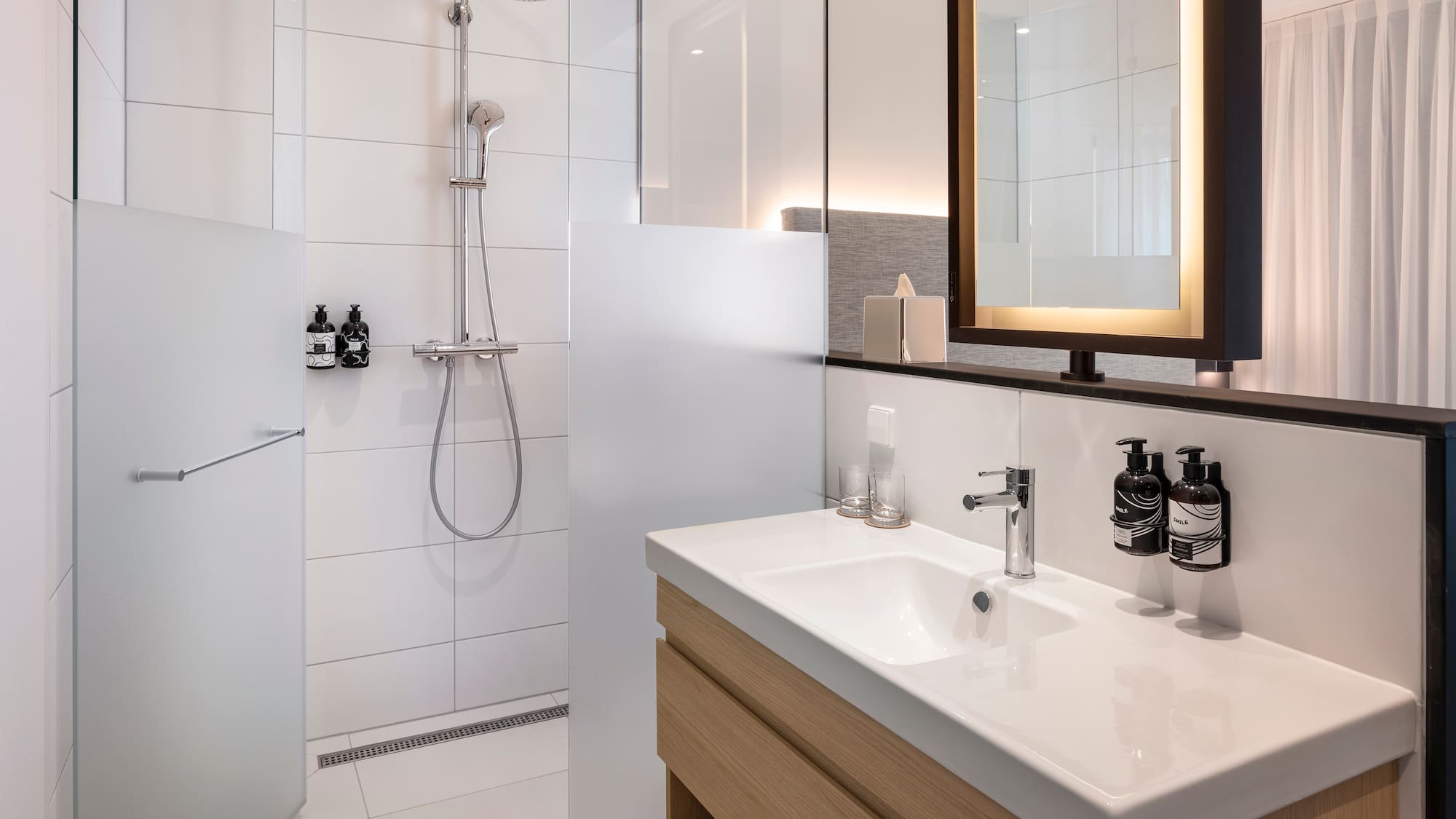 a bathroom with a shower and sink